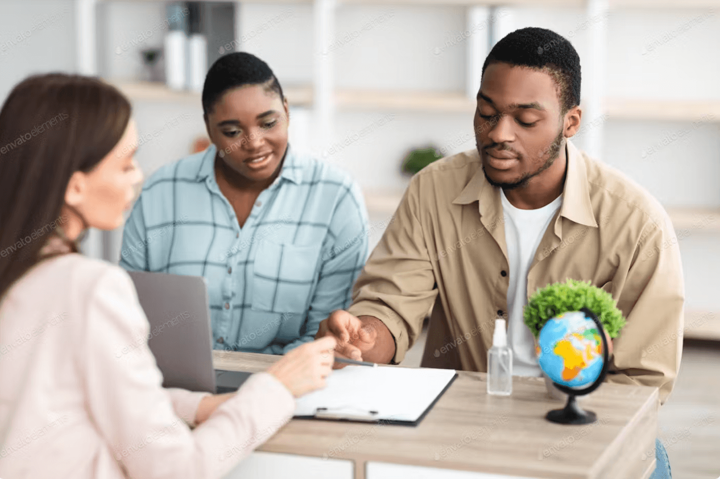 african-tourists-couple-signing-papers-during-cons-SJJYW7H