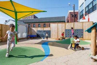 Students at LEO Inc. in Lynn enjoy their new outdoor play space.